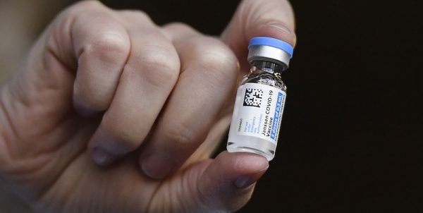 Johnson & Johnson COVID-19 vaccine is held by pharmacist Madeline Acquilano at Hartford Hospital in Hartford, Conn., Wednesday, March 3, 2021. Cities and states are rapidly expanding access to vaccines as the nation races to head off a resurgence in coronavirus infections and reopen schools and businesses battered by the pandemic. (AP Photo/Jessica Hill)