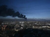 Black smoke rises from a military airport in Chuguyev near Kharkiv  on February 24, 2022. - Russian President Vladimir Putin announced a military operation in Ukraine on Thursday with explosions heard soon after across the country and its foreign minister warning a "full-scale invasion" was underway. (Photo by Aris Messinis / AFP)